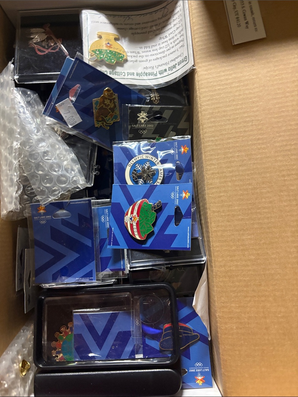 Assorted Blue-Backed Enamel Pins with Holiday and Olympic Motifs